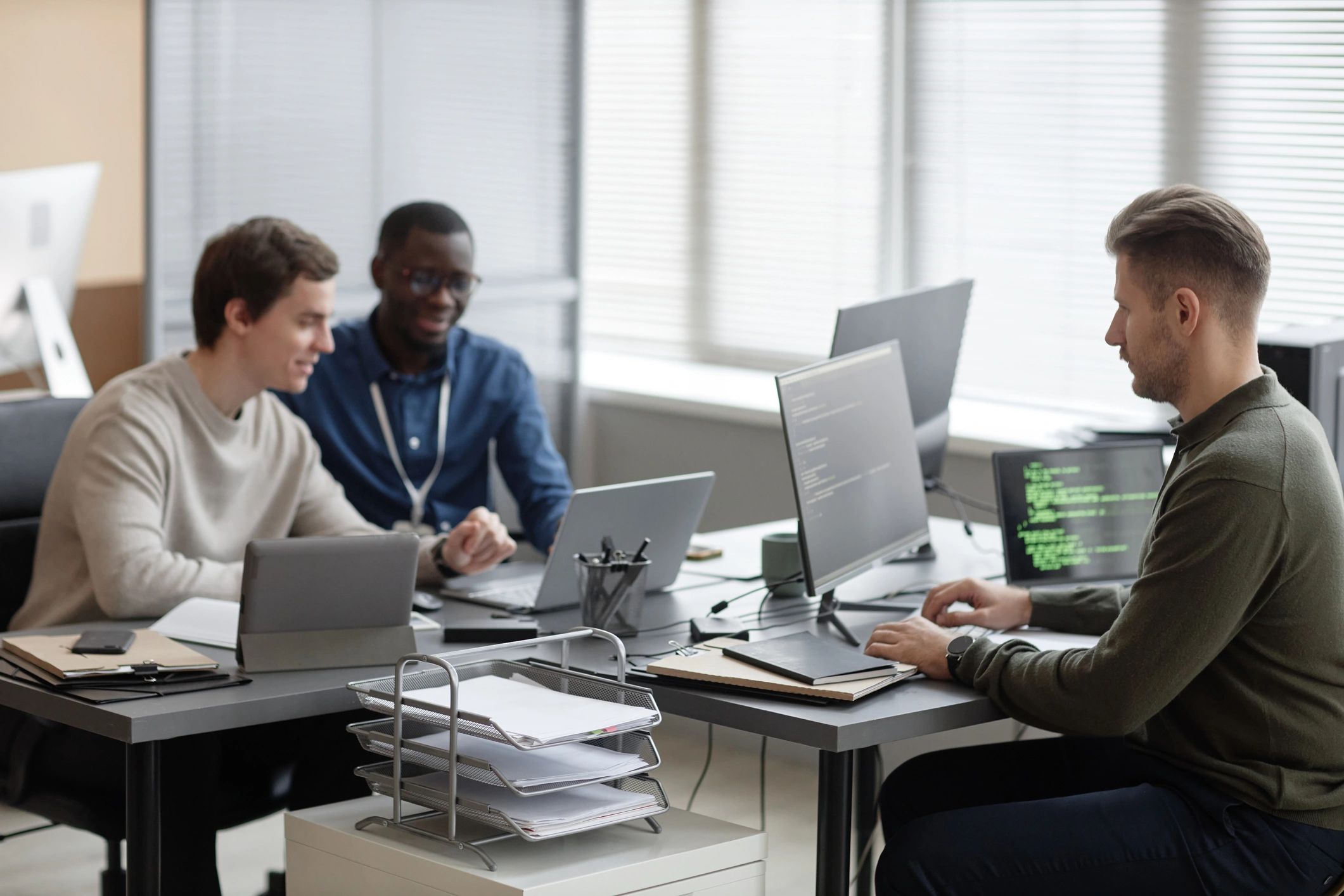 Software development team collaborating in a modern office